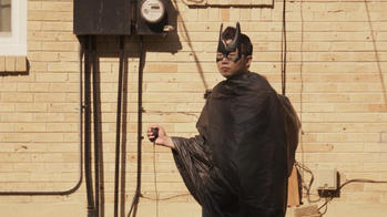 the artist dressed as batman
