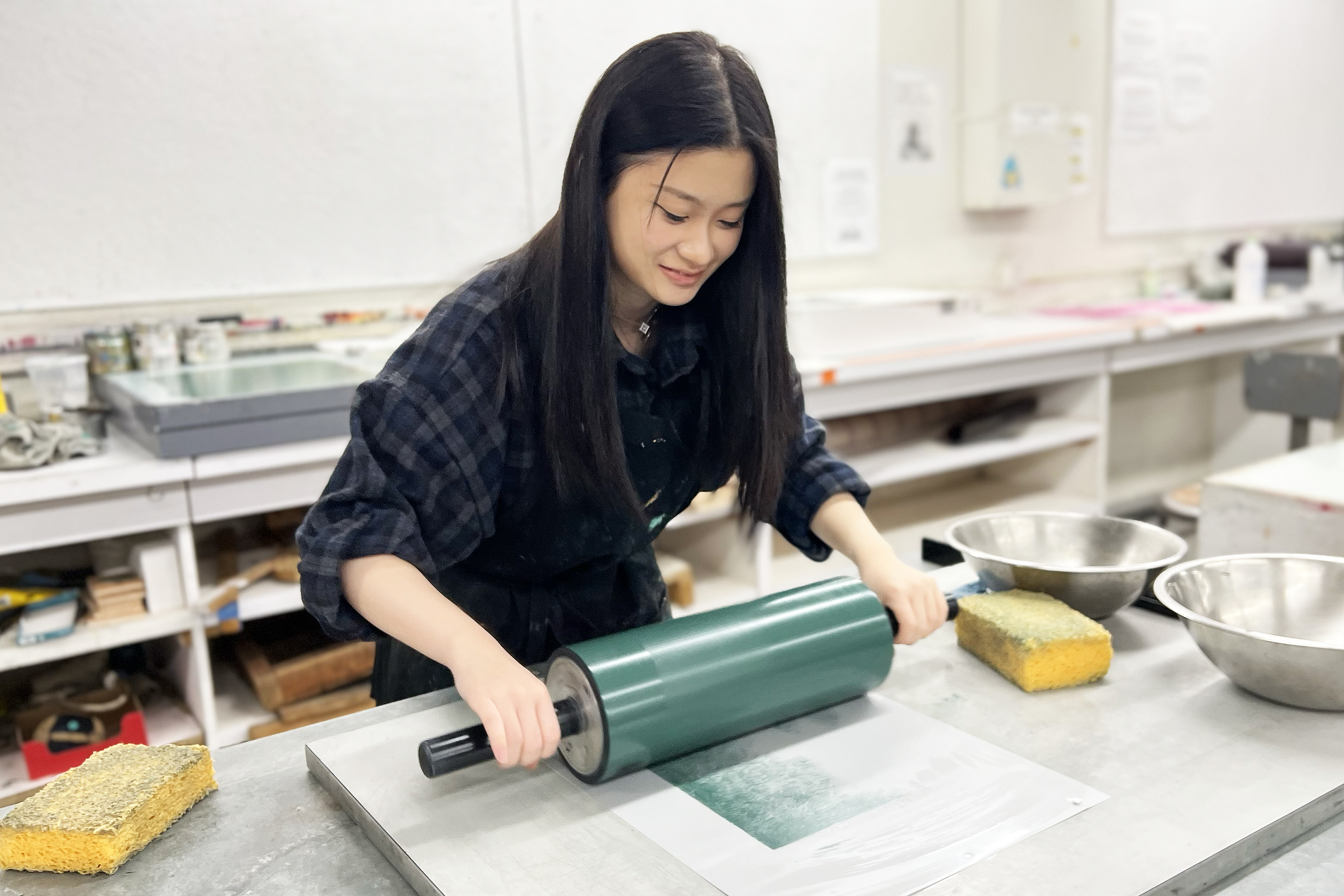 a student rolls a vibrant green ink out