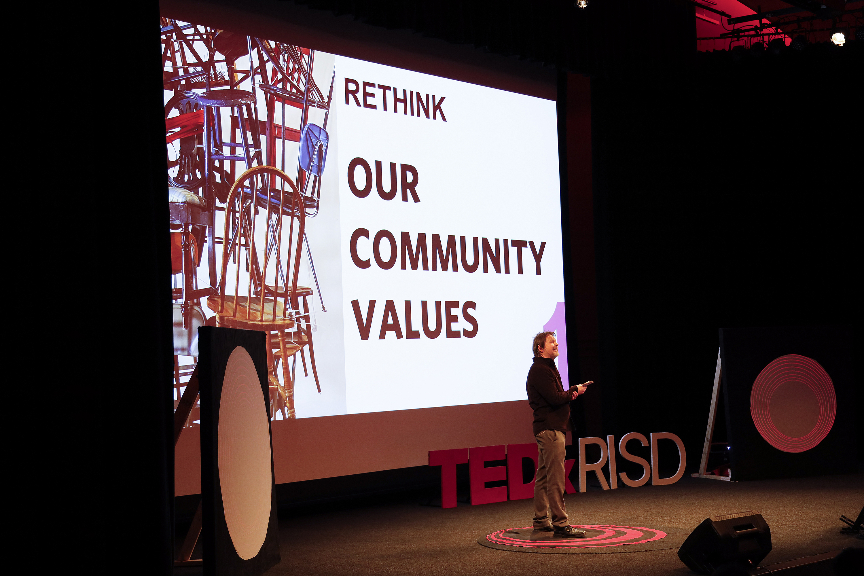 speaker Markus Berger encourages the audience to rethink community values