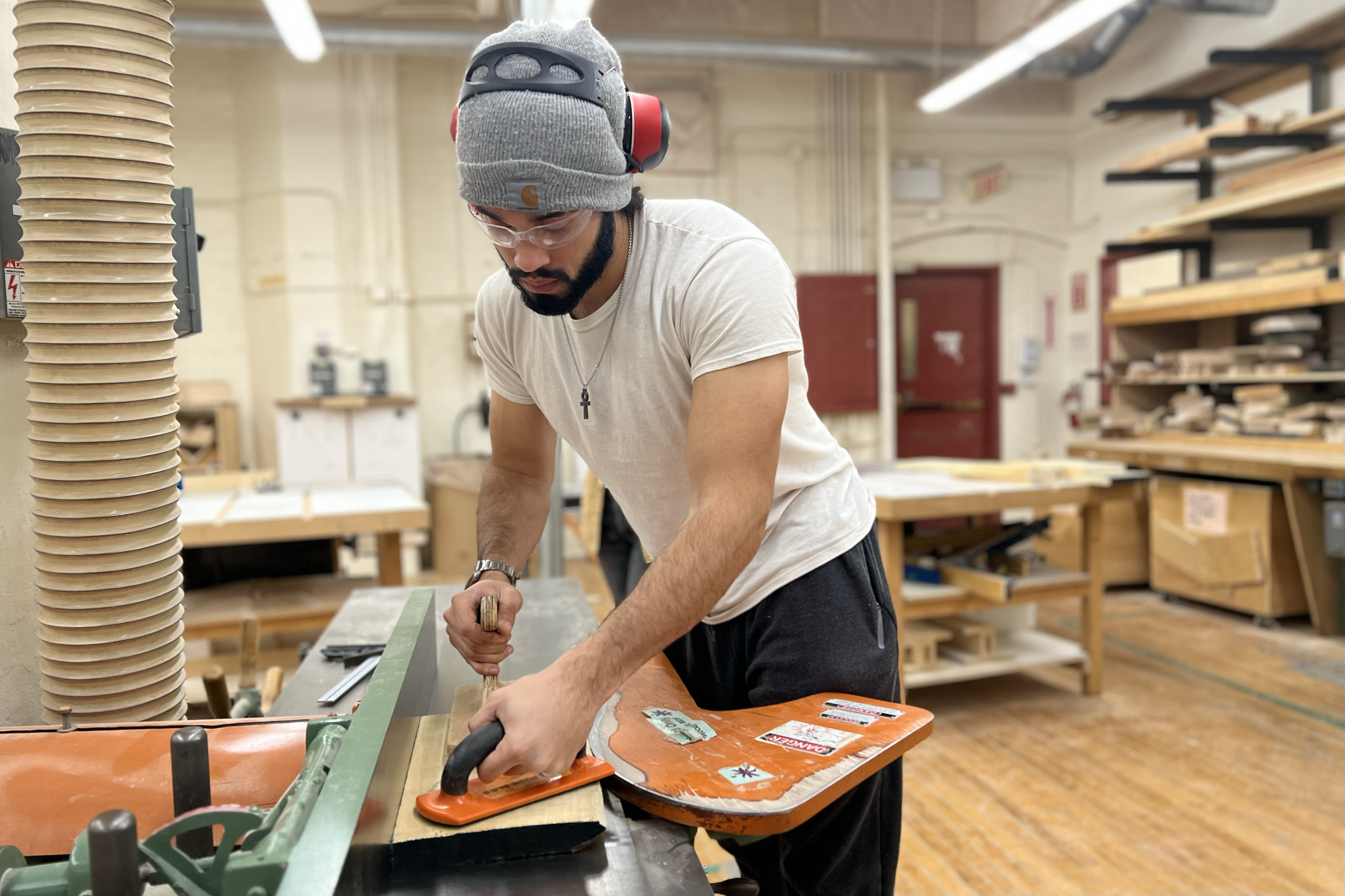 Ashur Clark using power tools in the woodshop at RISD