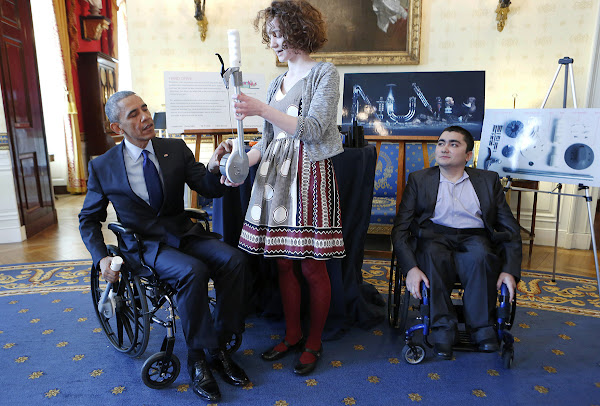 Kate Reed BRDD 21 ID demonstrating the 3D printable Hand Drive Wheelchair Attachment to President Barack Obama