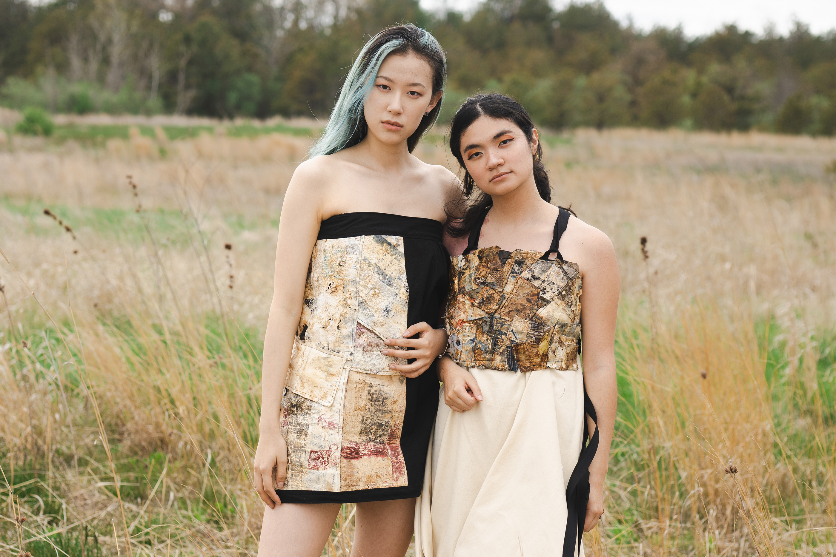 Two models pose in a field