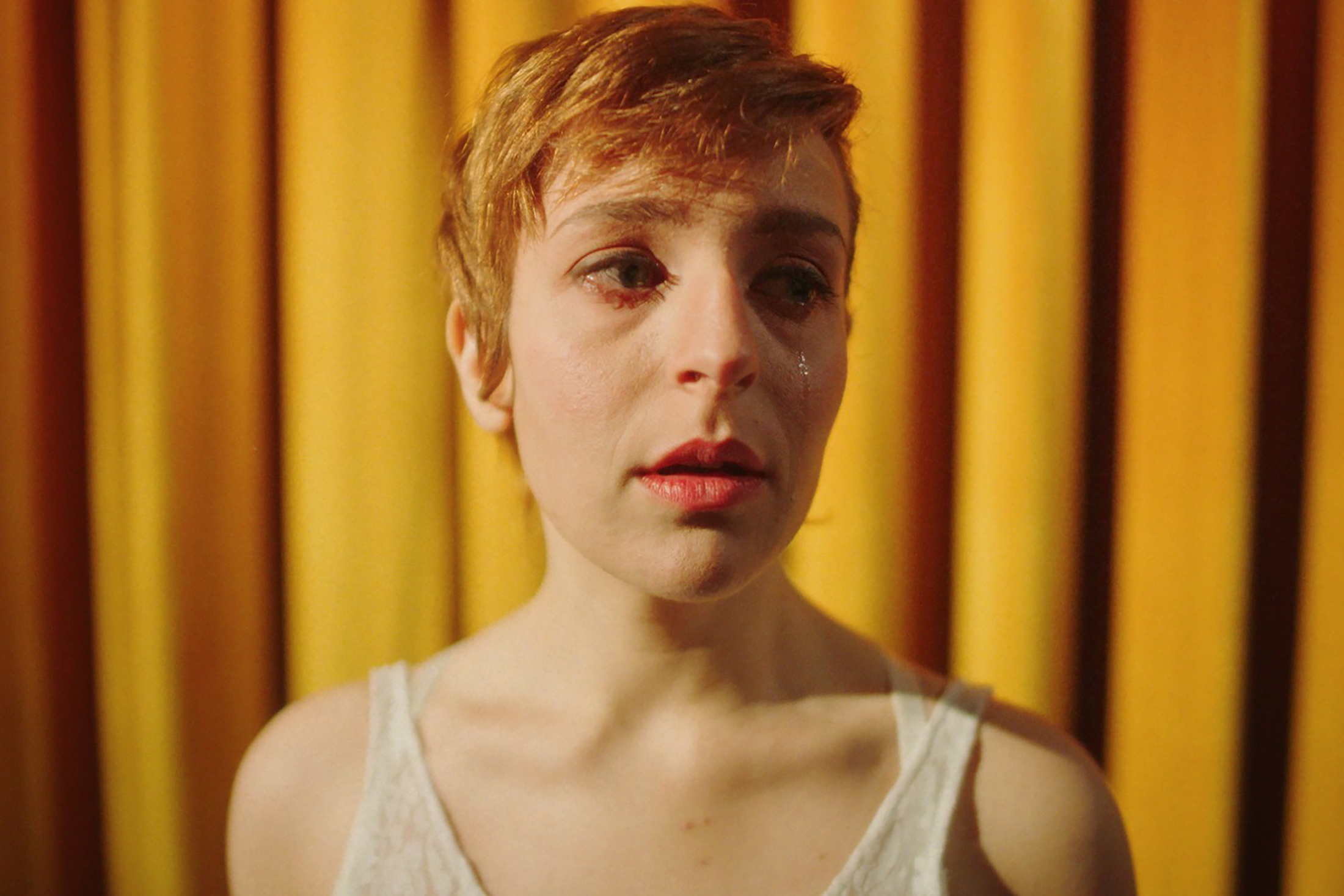 still from Bella Borgh film showing the protagonist crying