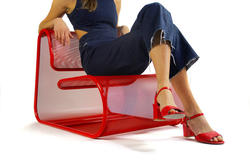 A chair by Furniture Design alum Elizabeth Dimitroff, with person seated