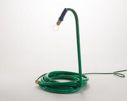 A lamp by Furniture Design alum Kate Weimar, made with a garden hose