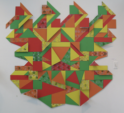 bright multicolored geometric student artwork on display