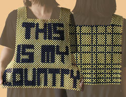 a yellow beaded top that reads "THIS IS MY COUNTRY" on the front, with blue stripes criss-crossing on the back