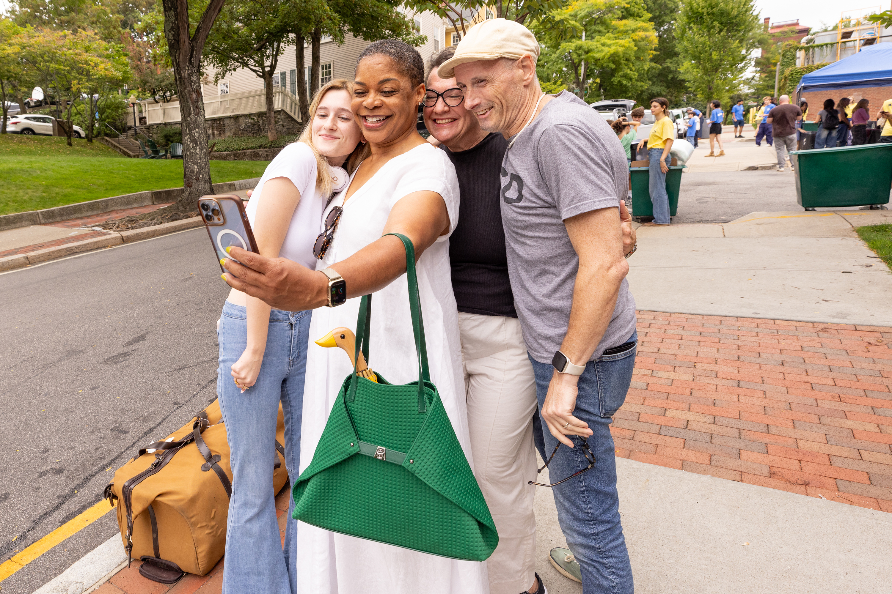 President Williams takes a selfie with new student and her parents