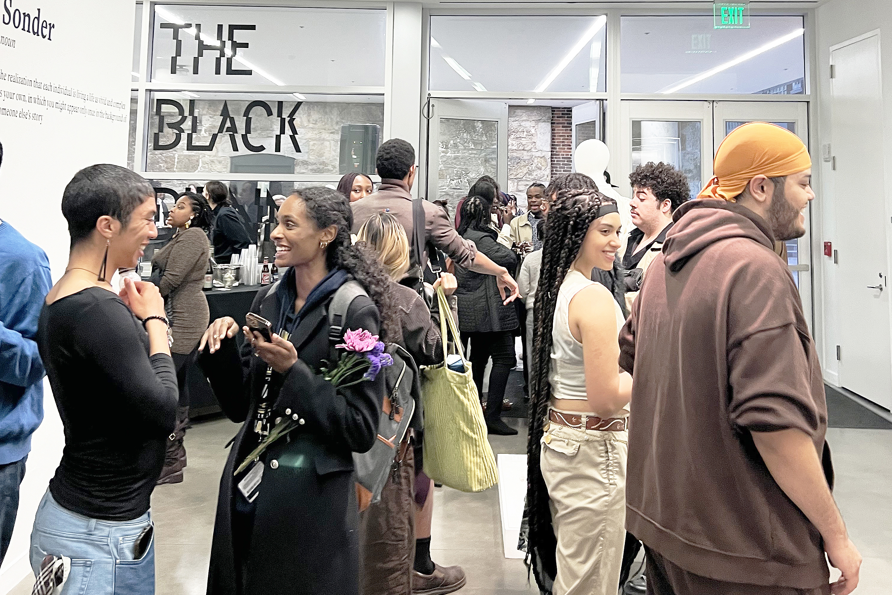 the community gathers for the opening of the show