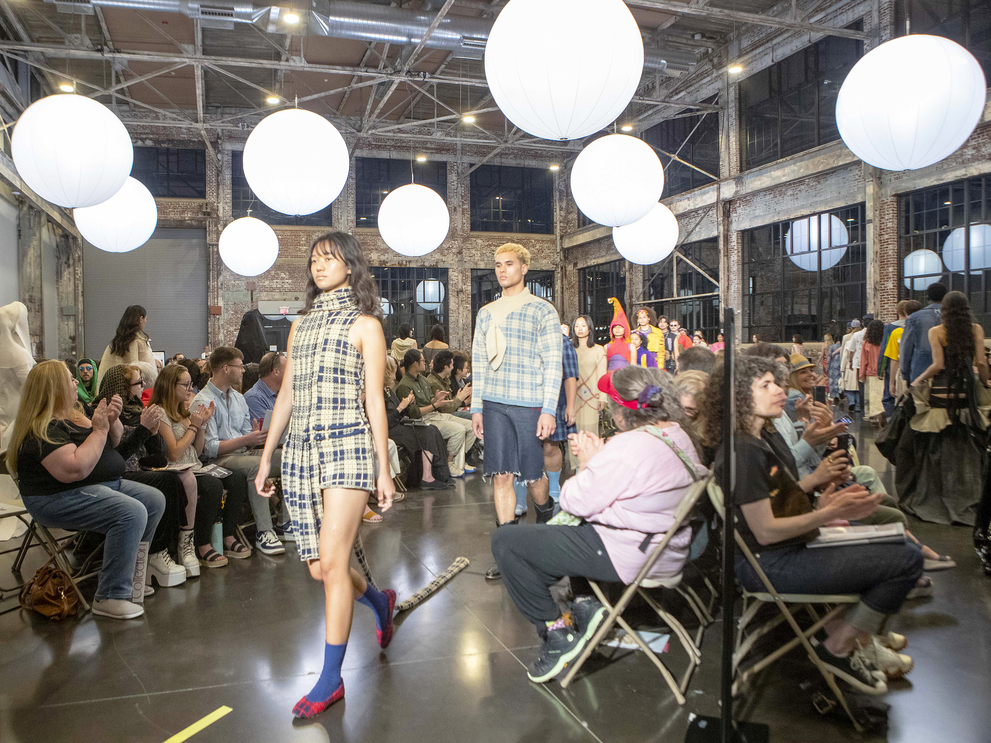 models wearing plaid looks by Fiona Fronnapiel walk the runway