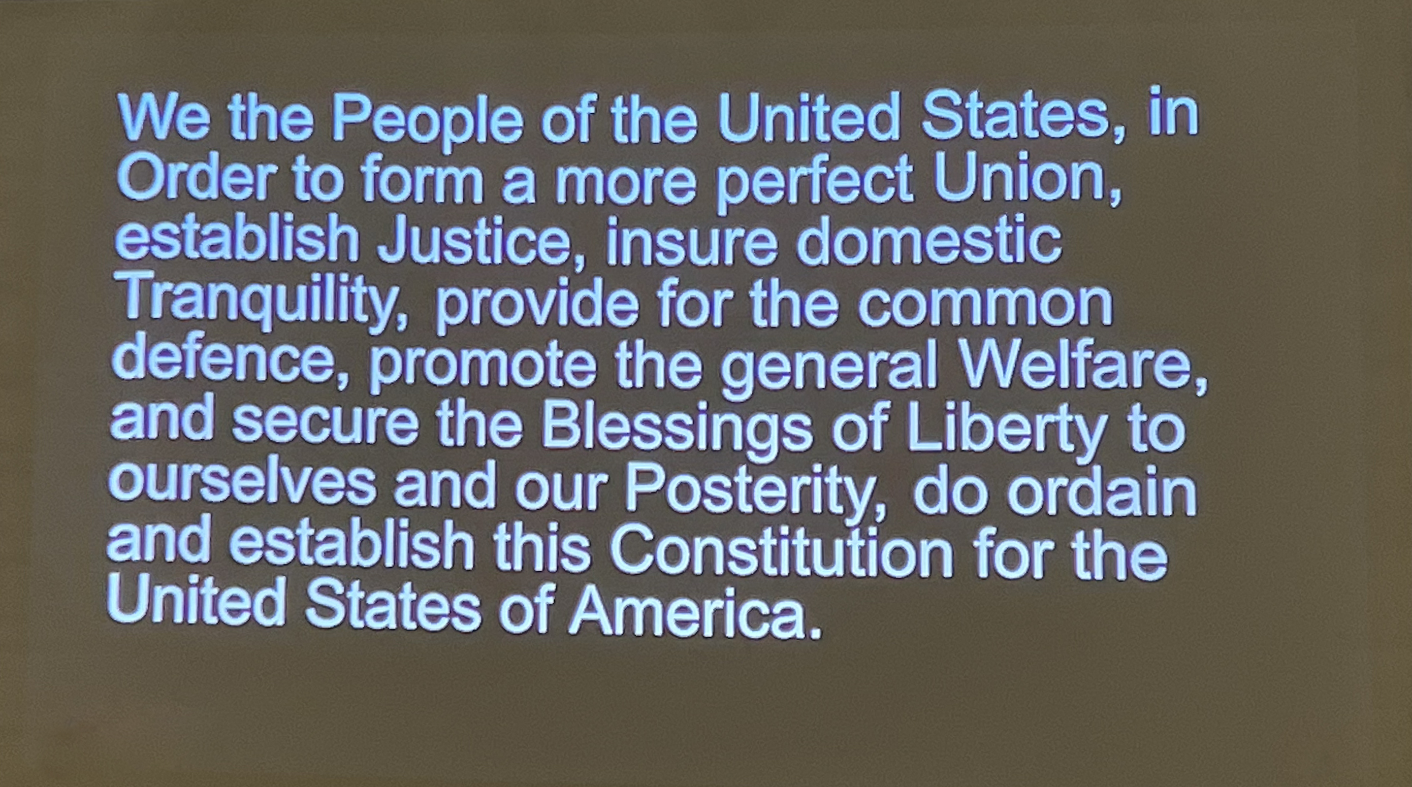 slide showing the beginning words of the US Constitution
