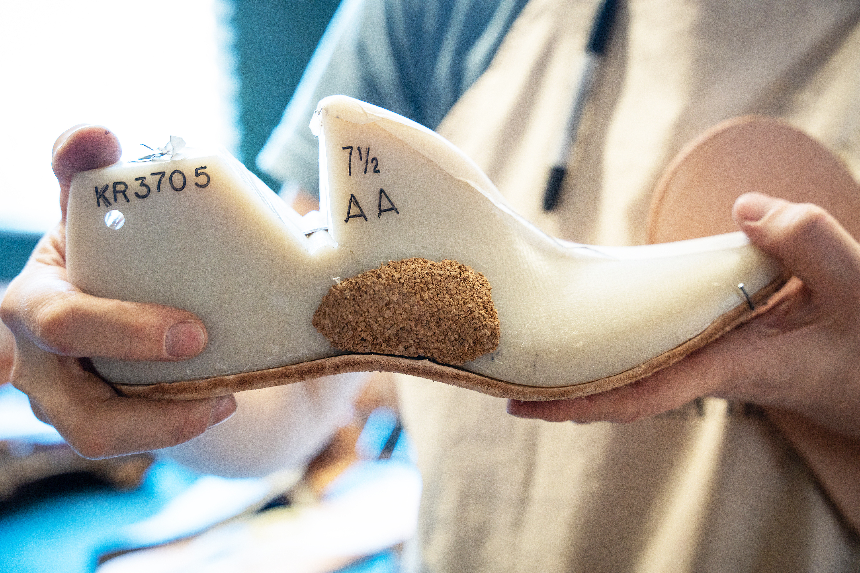 attaching the sole of the boot to the foot form (or last)