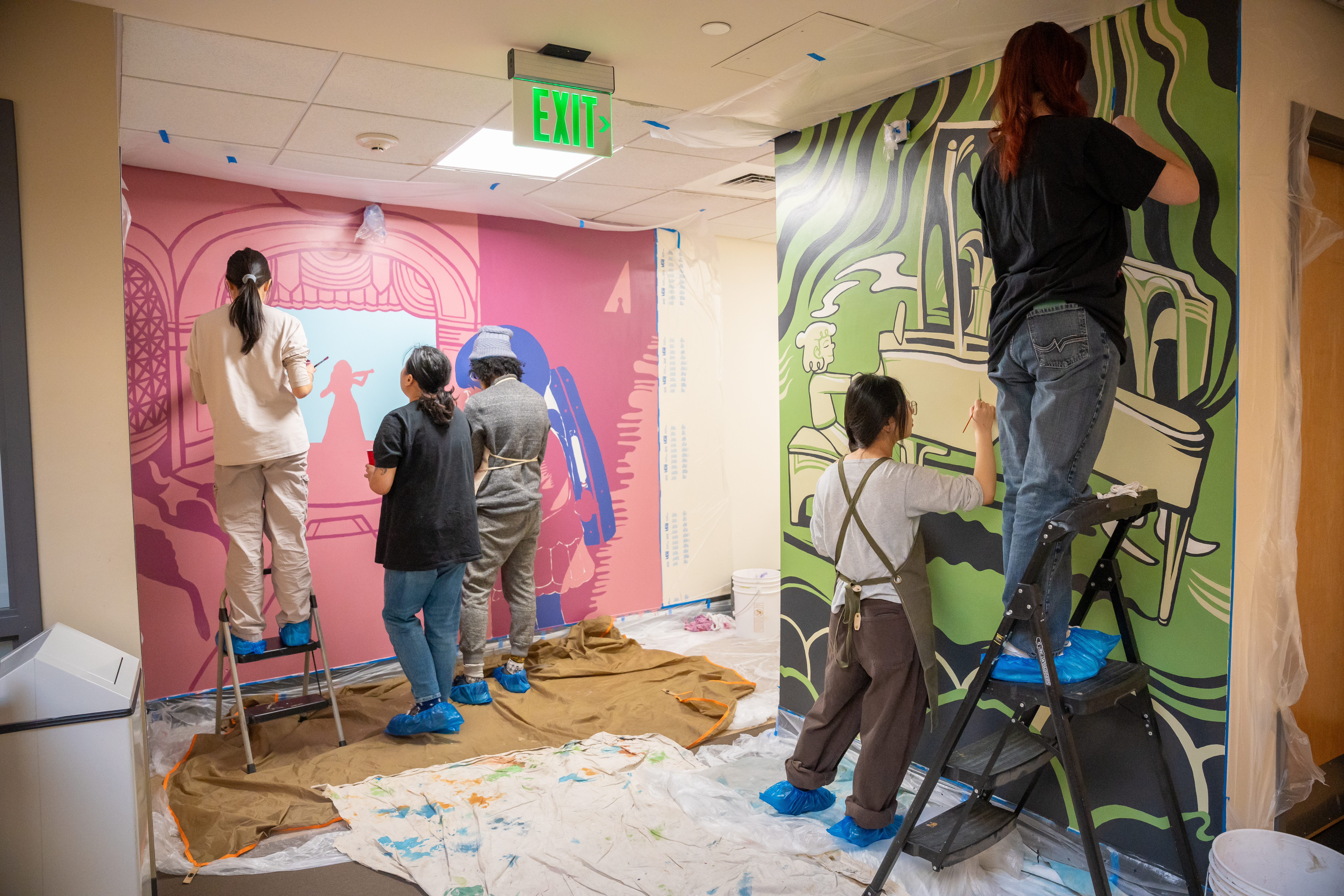 Students working on murals