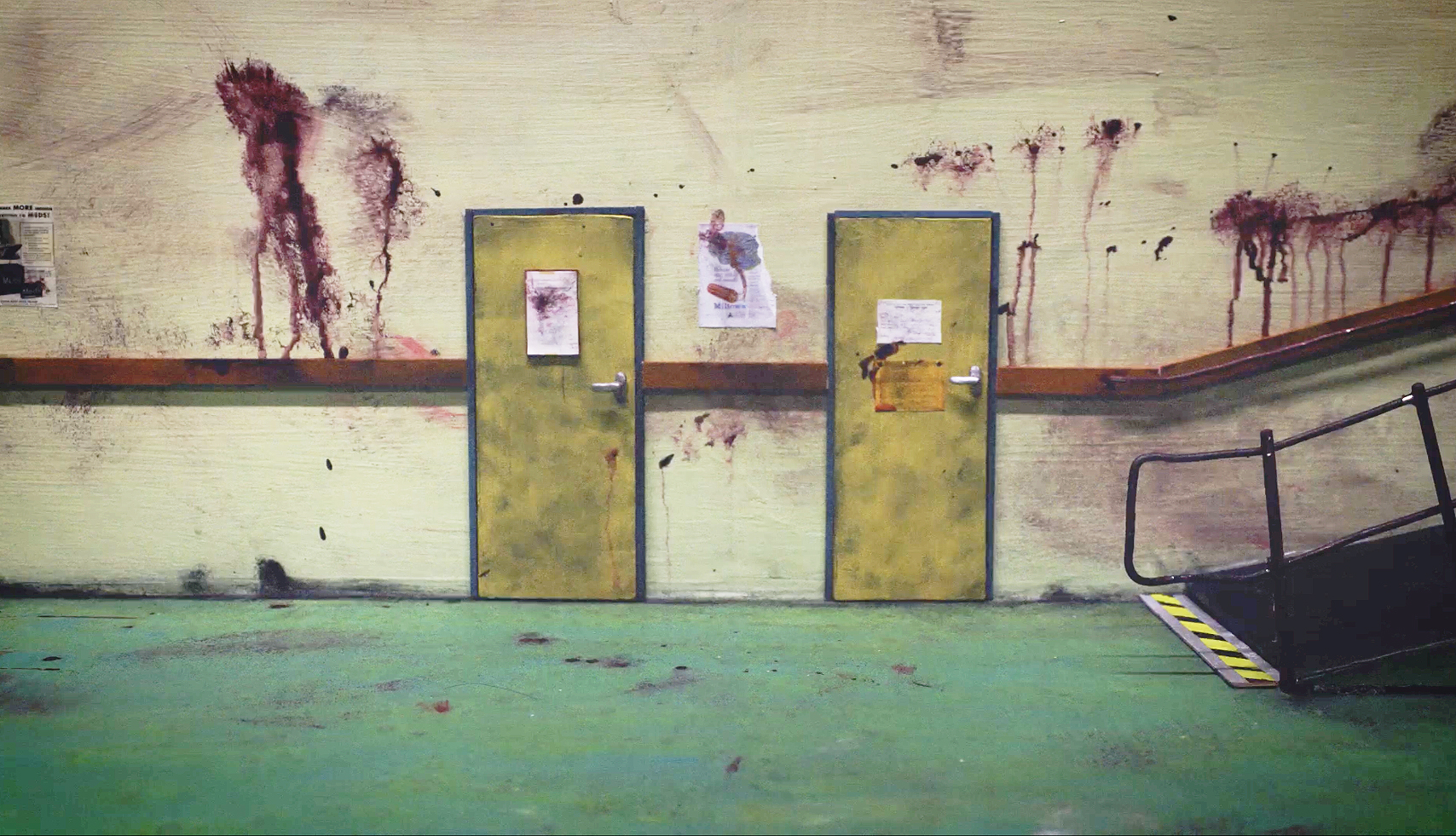 a blood-soaked basement room with no people inside