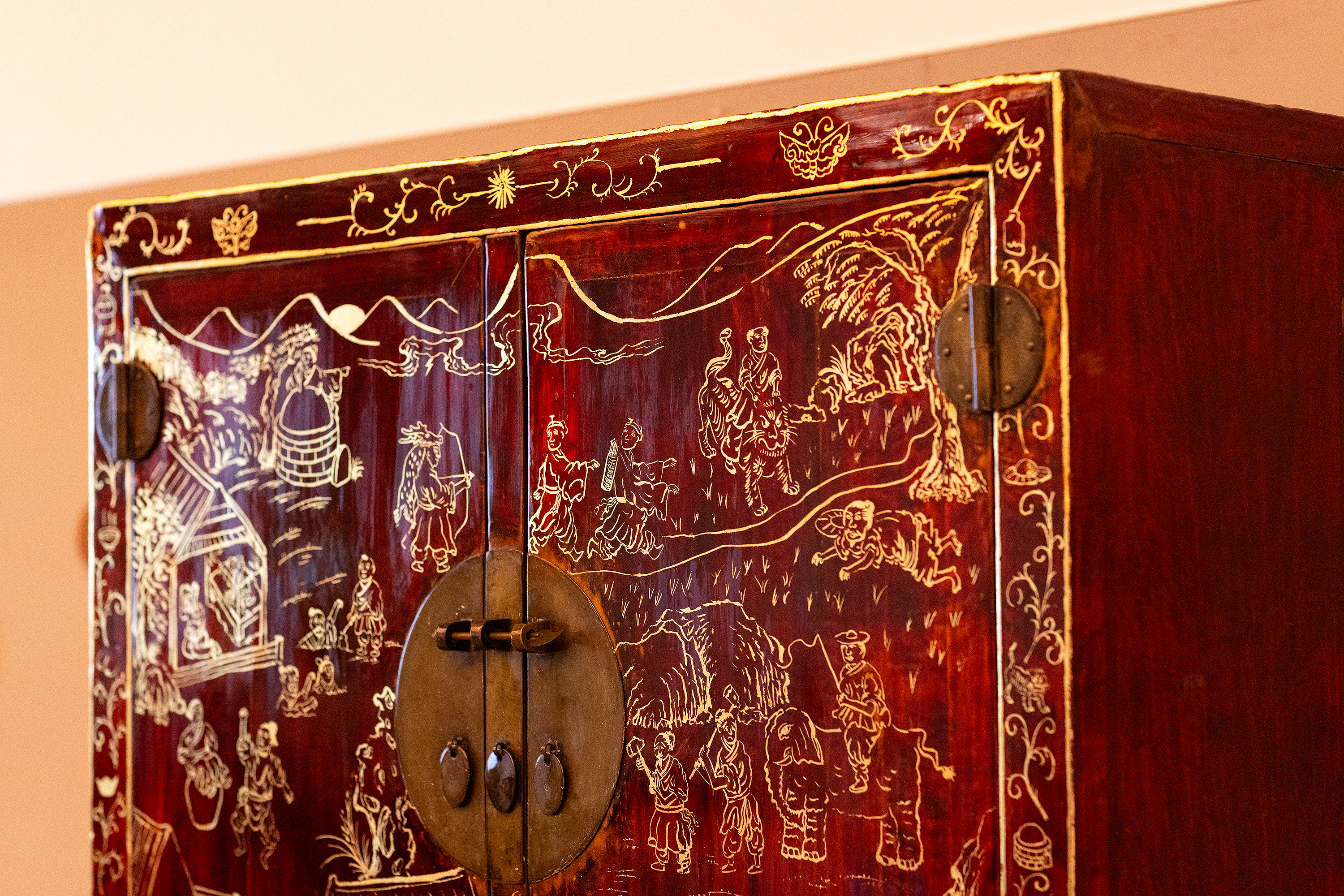 detail of a carved red chest created by a Furniture Design grad student