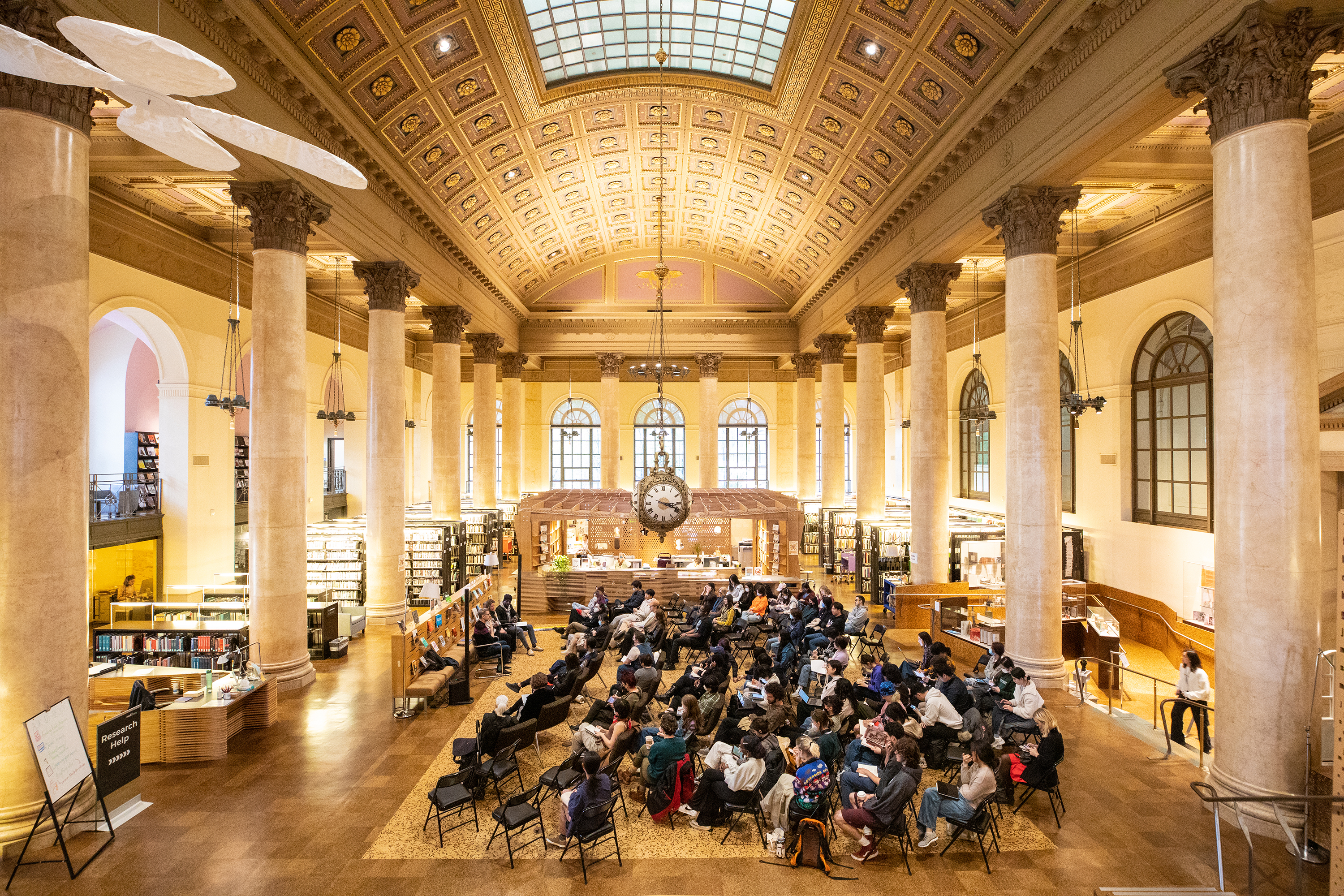 community gathered for a lecture in the Fleet Library at RISD