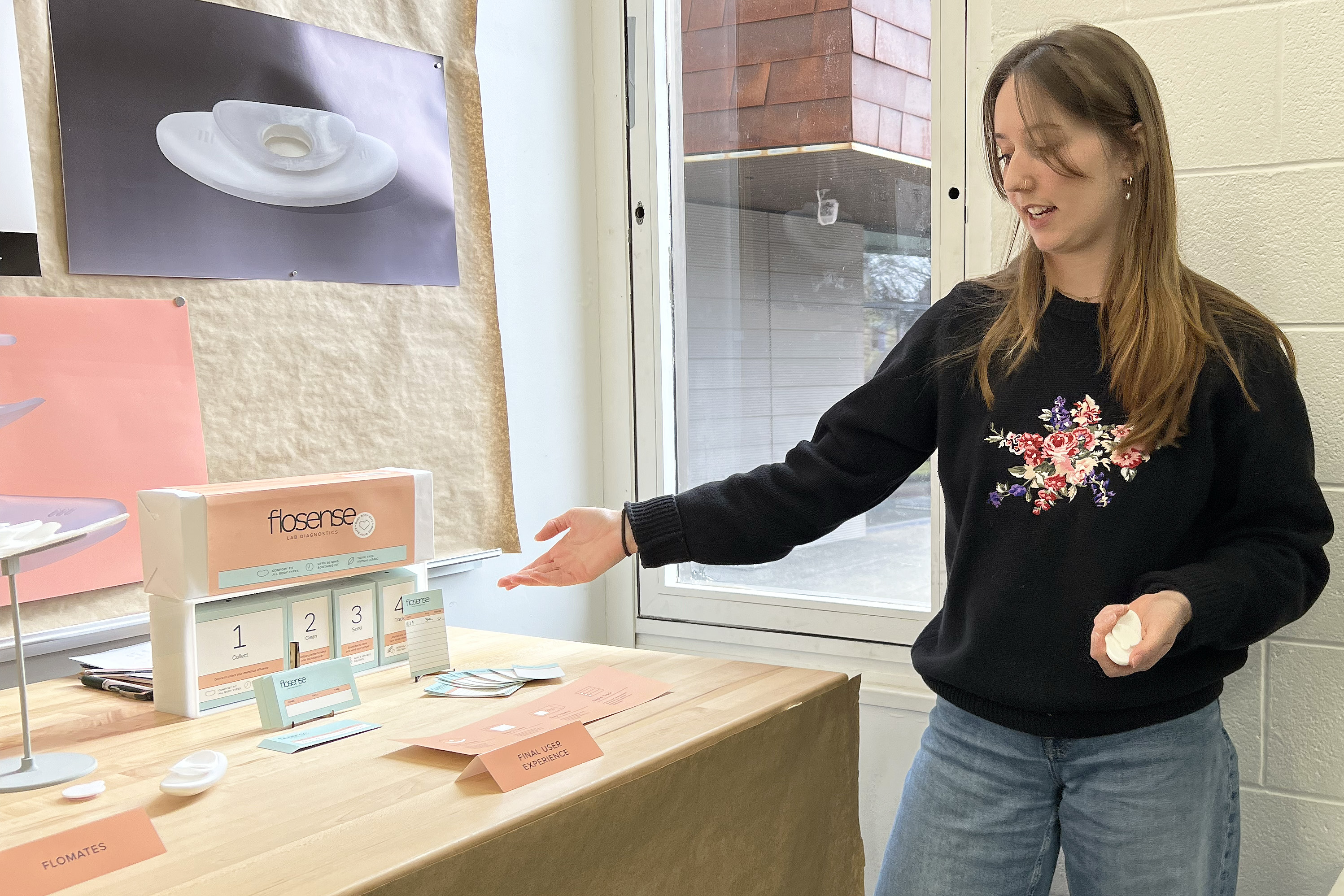 student presents menstrual blood collection device design