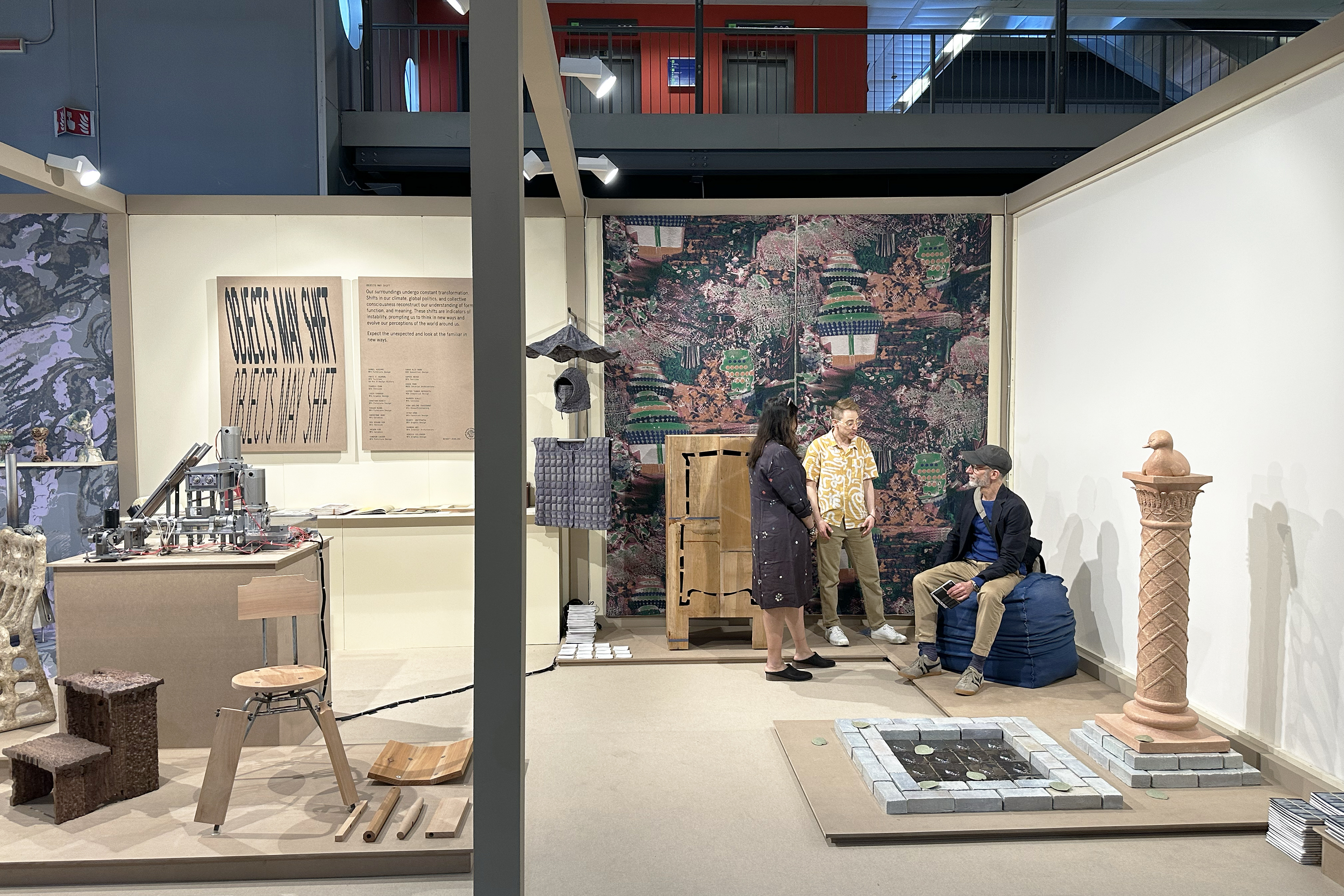 Yukti Agarwal and Kip Reinsmith discuss their work with a booth visitor