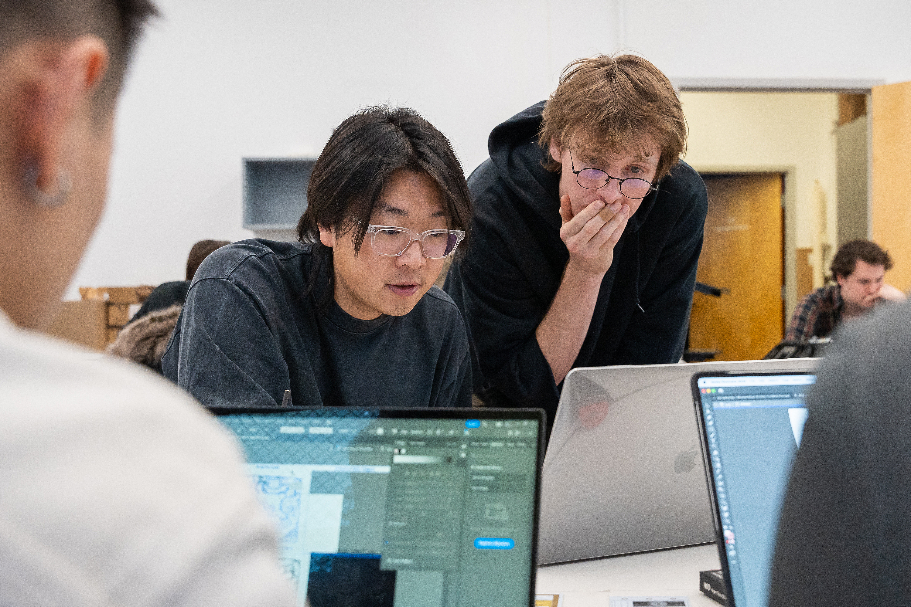 visiting artist Brian Oakes advises a Digital + Media student