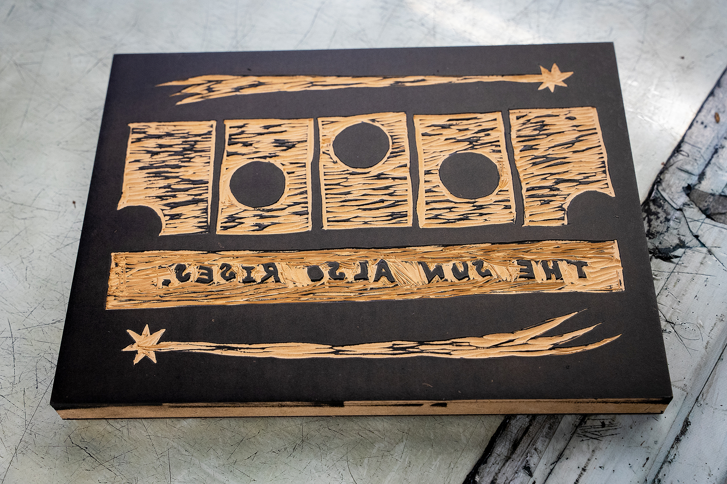 student-made woodblock with text in reverse