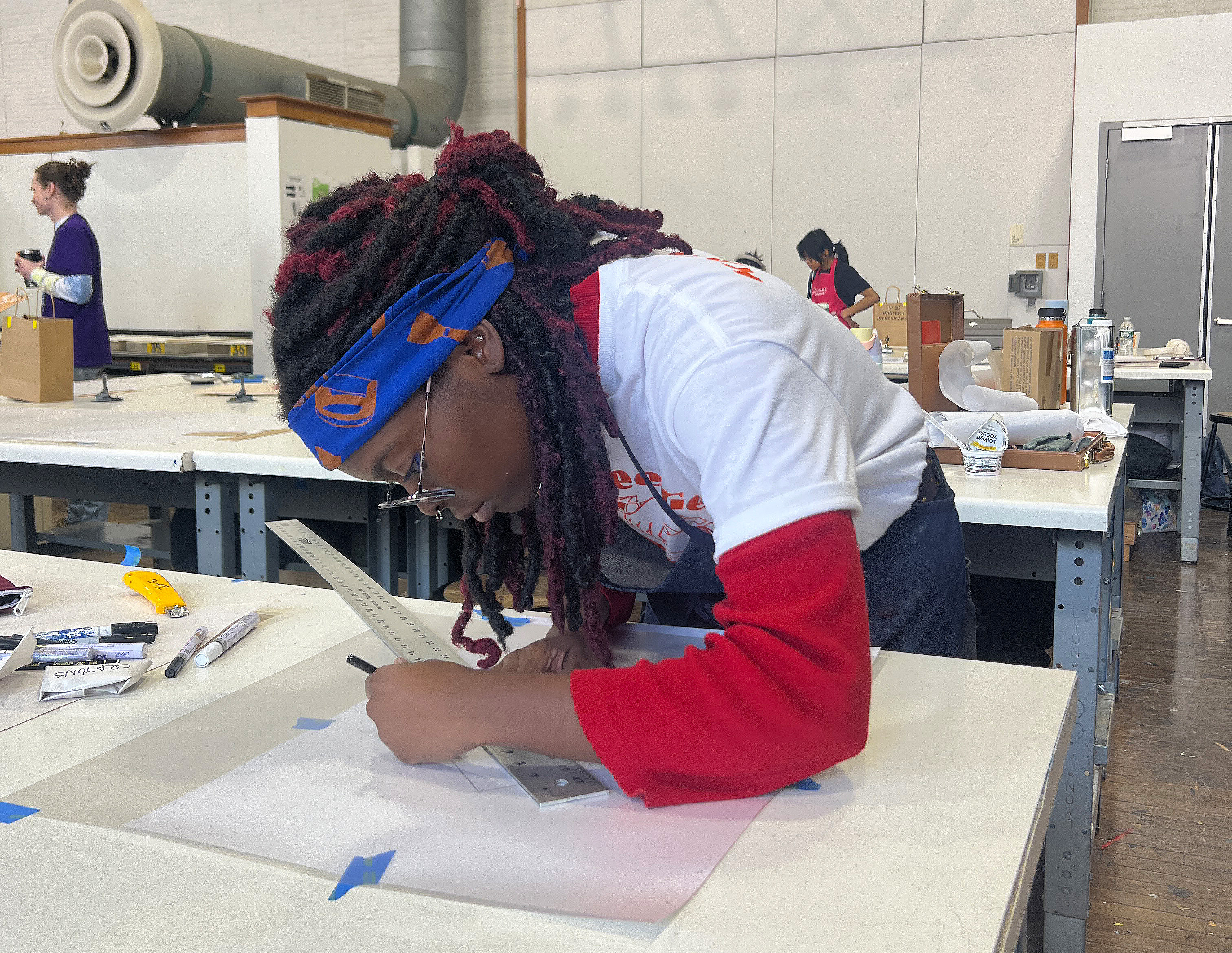 a student works carefully using a ruler