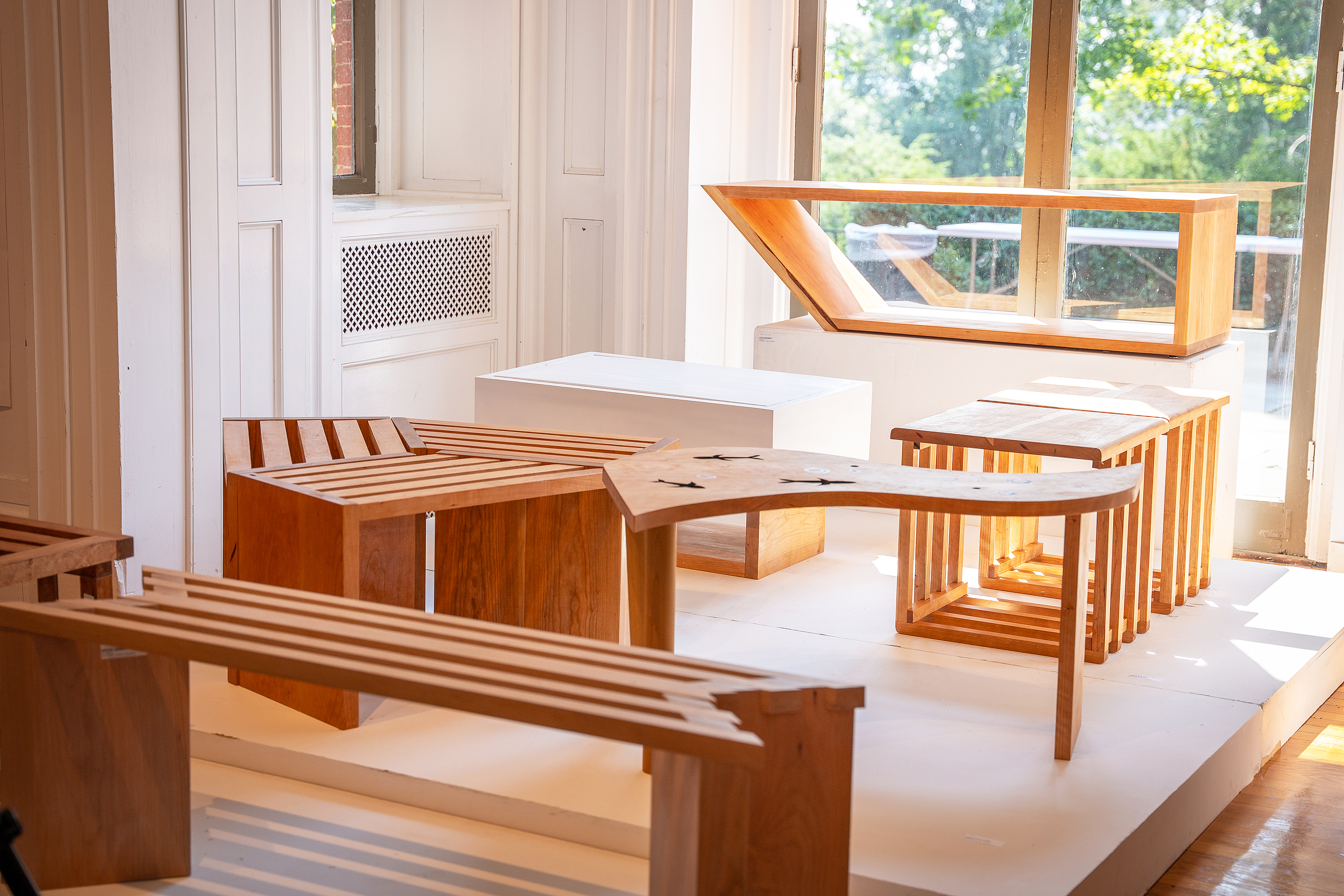 wooden benches on display in Woods-Gerry Gallery