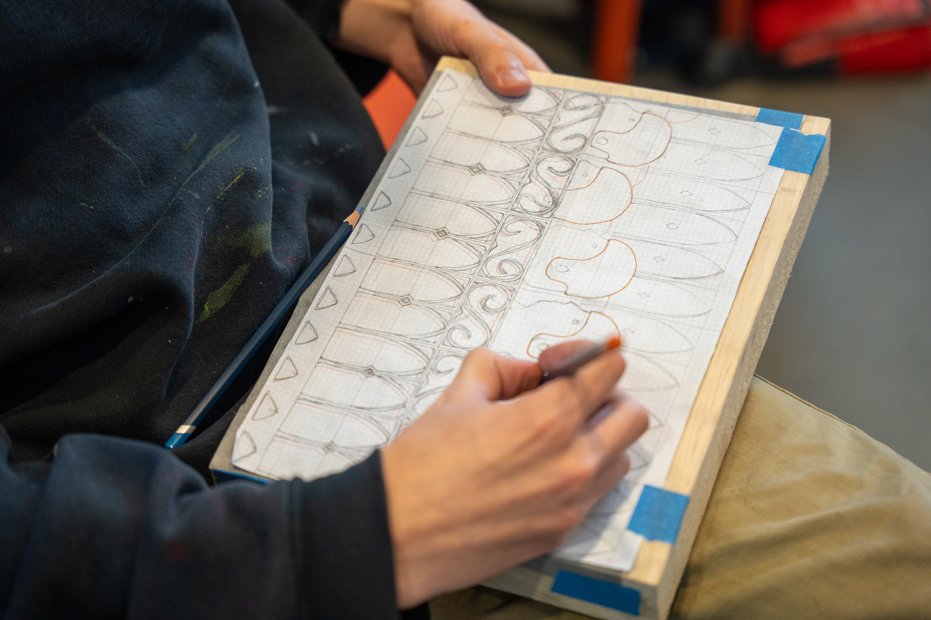 a student drawing their design