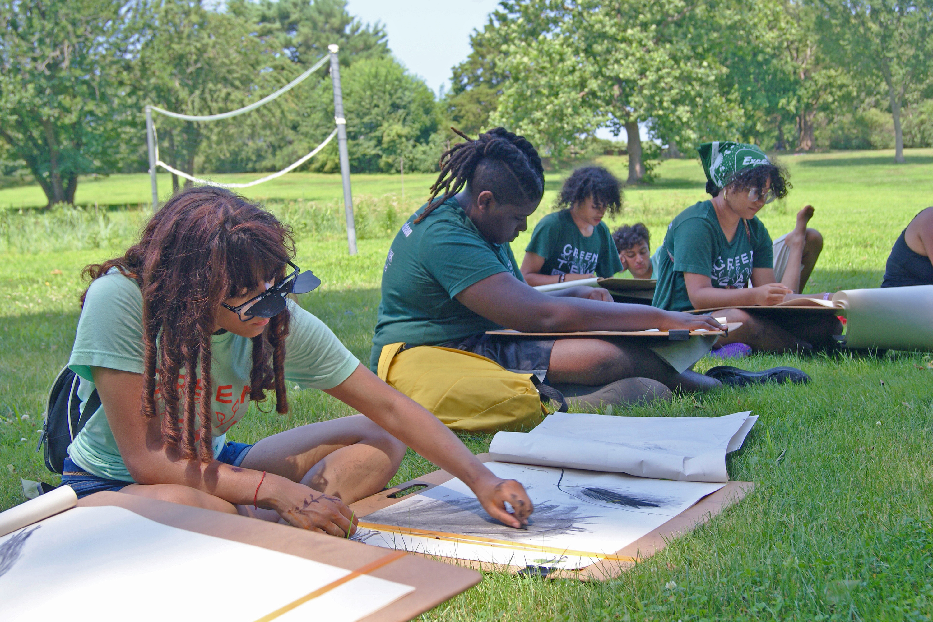 workshop participants sketching outdoors