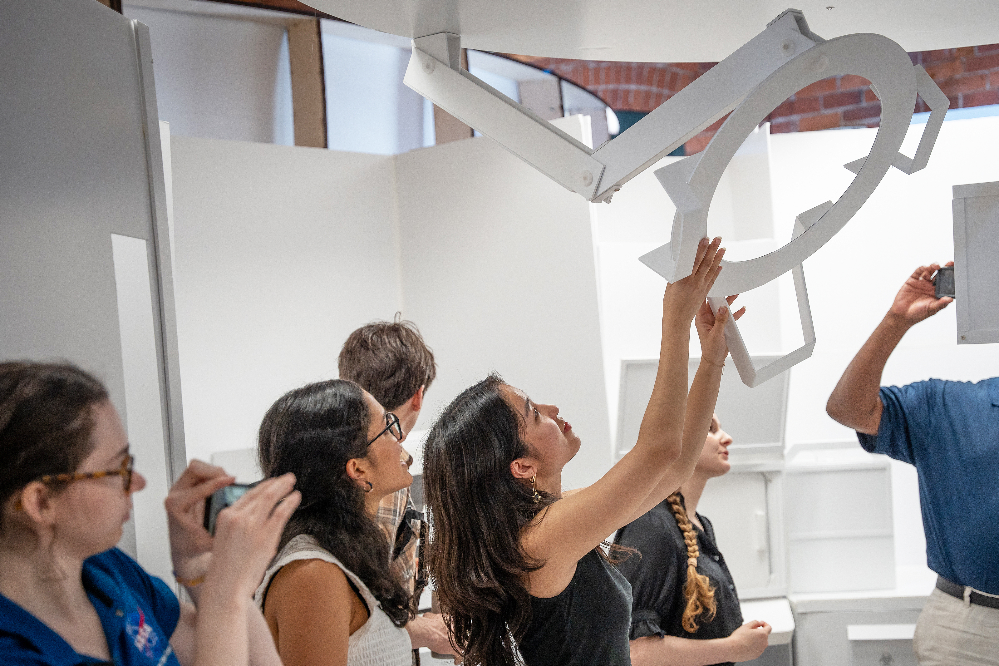 ID students in a NASA-related course examine components of a design being critiqued