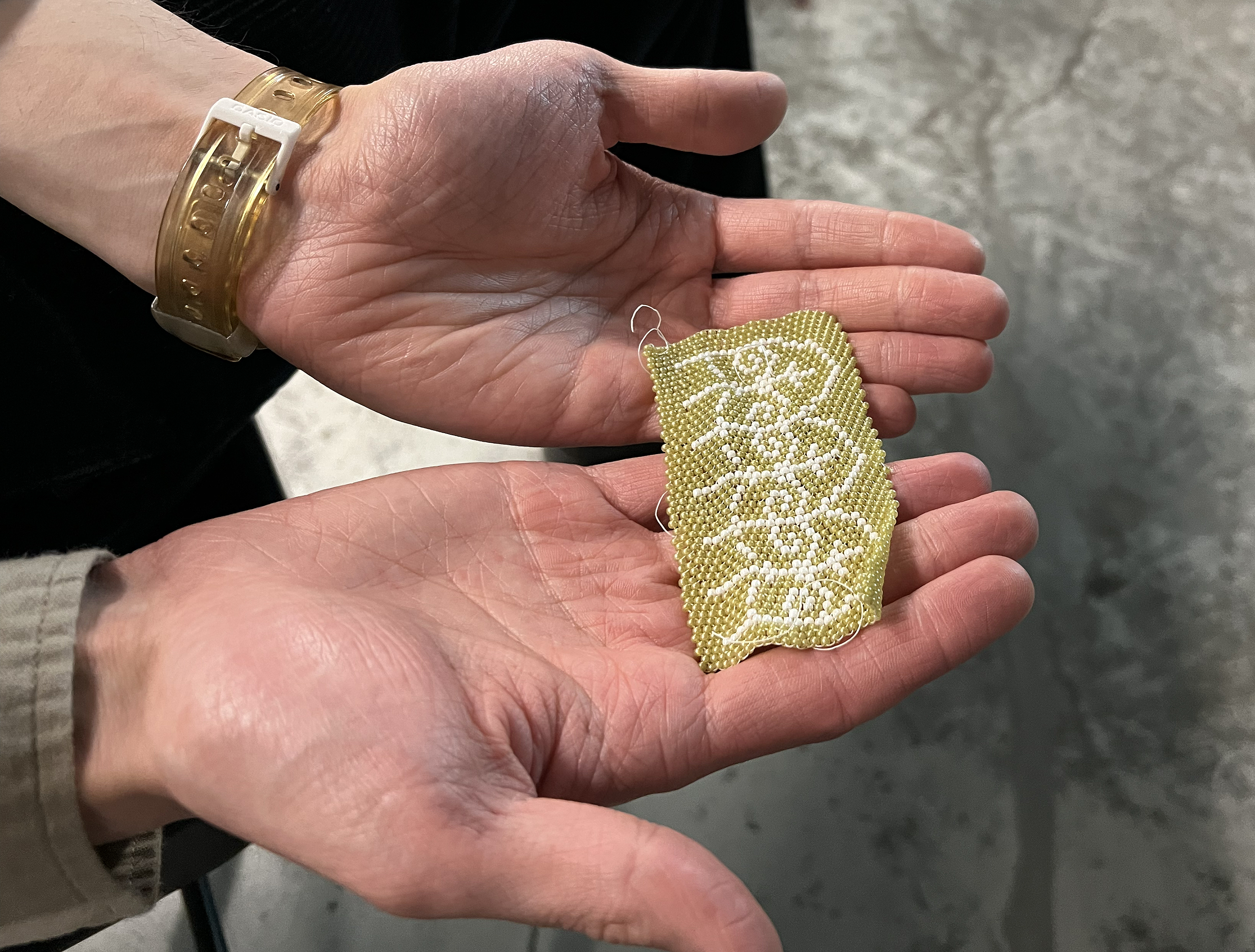 students seek inspiration from a beaded design pattern