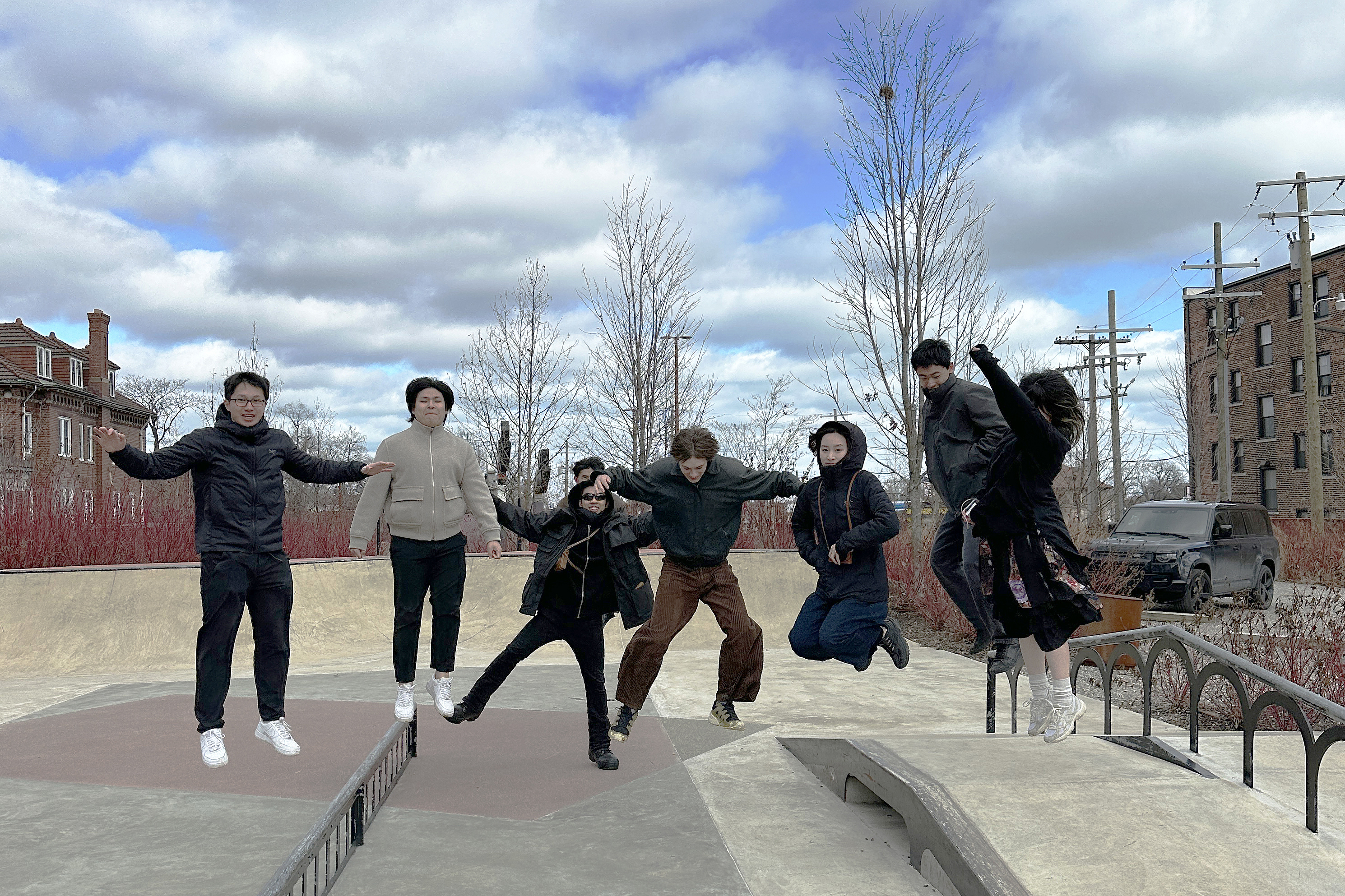 students jump into the air in Detroit skate park