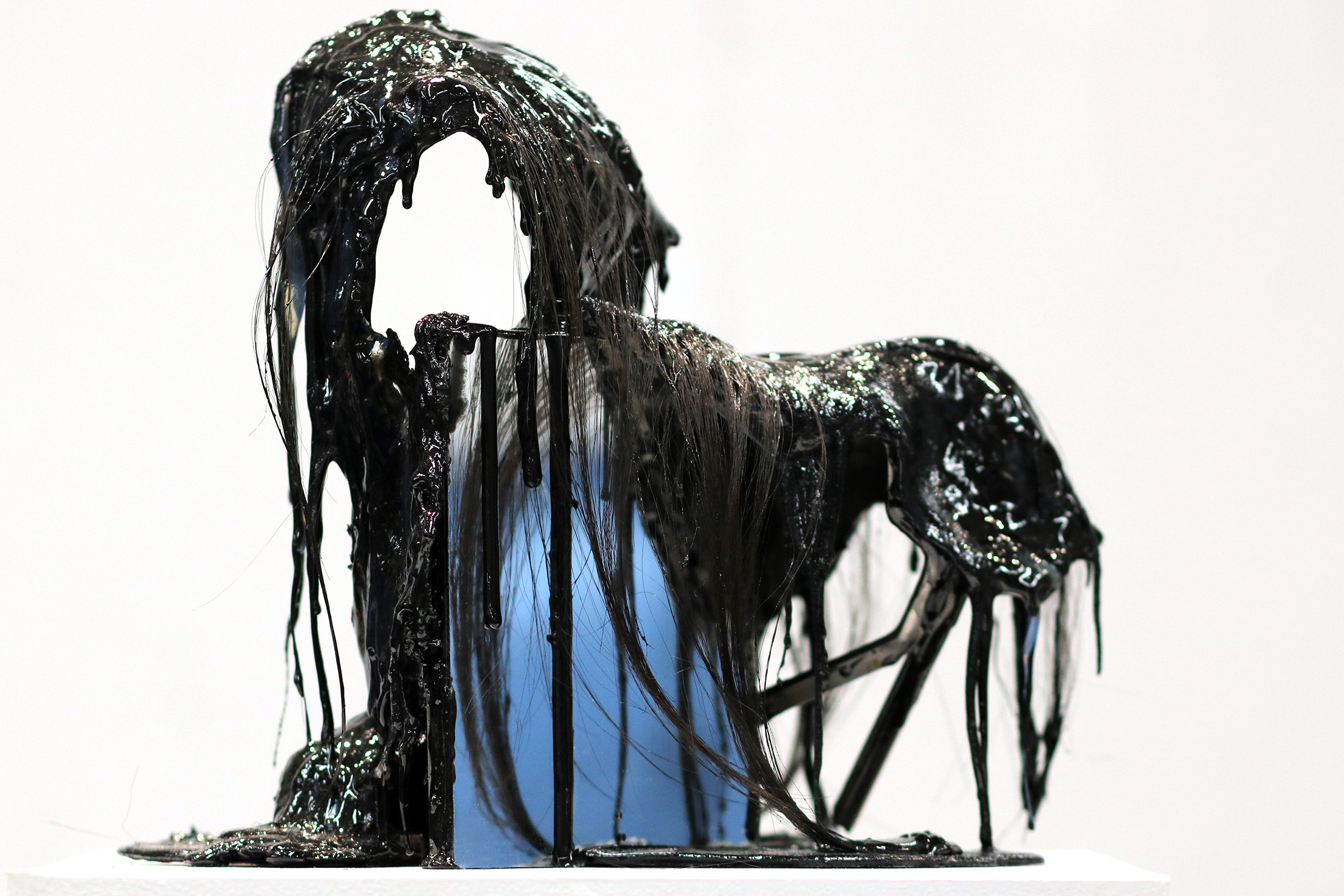 Sludge-covered sculpture.