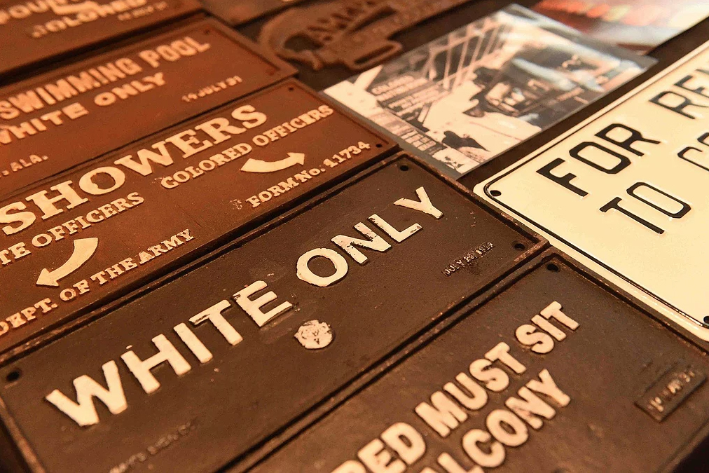 signs of segregation stating whites only