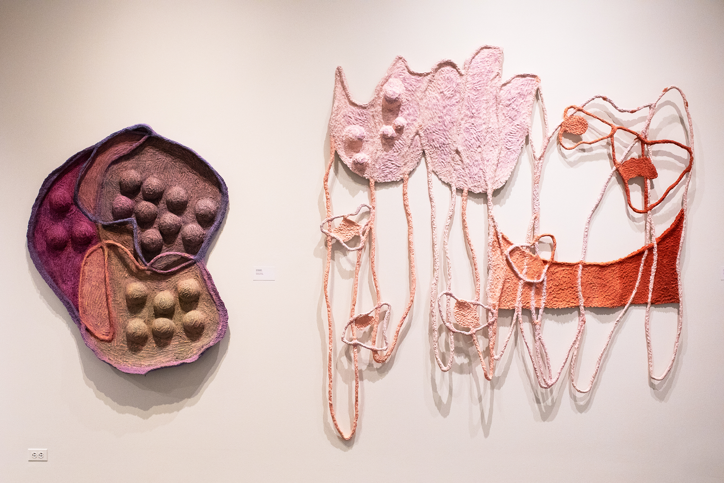 abstract wall art with colorful paper pulp on metal