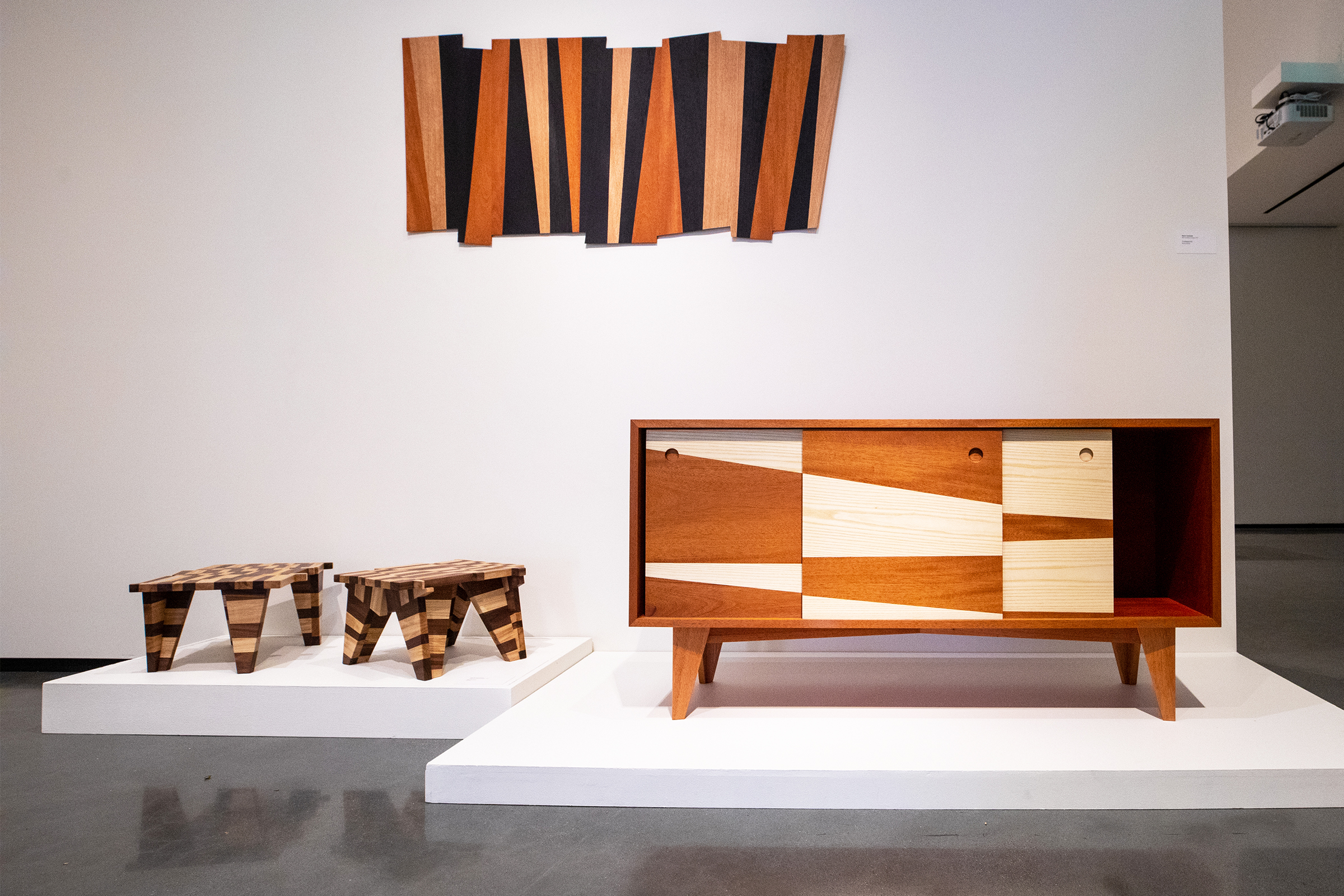 three wooden pieces featuring different toned woods