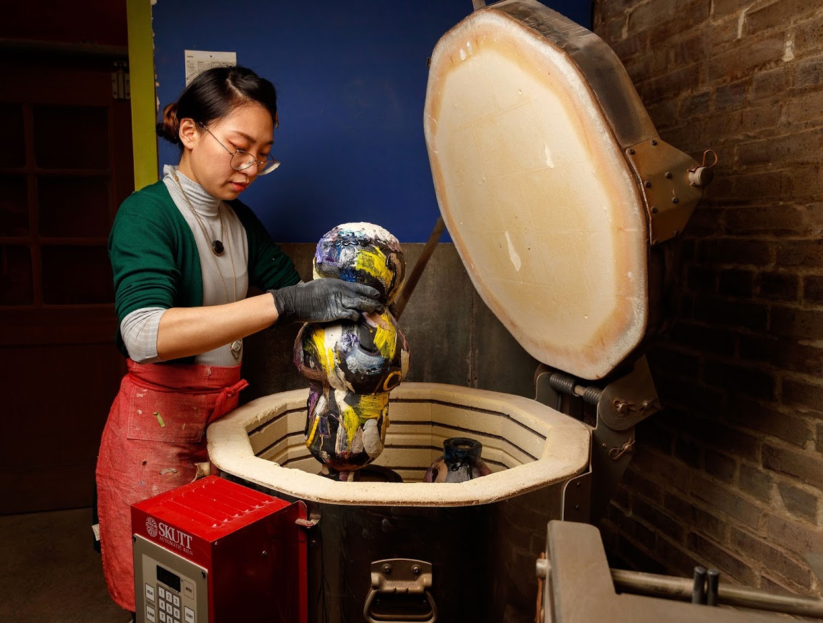 Ling Chun MFA 16 CR pulls piece from kiln