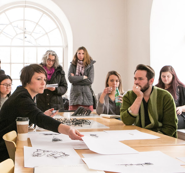 Department Head Tracy Steepy, at left, leads a department-wide critique