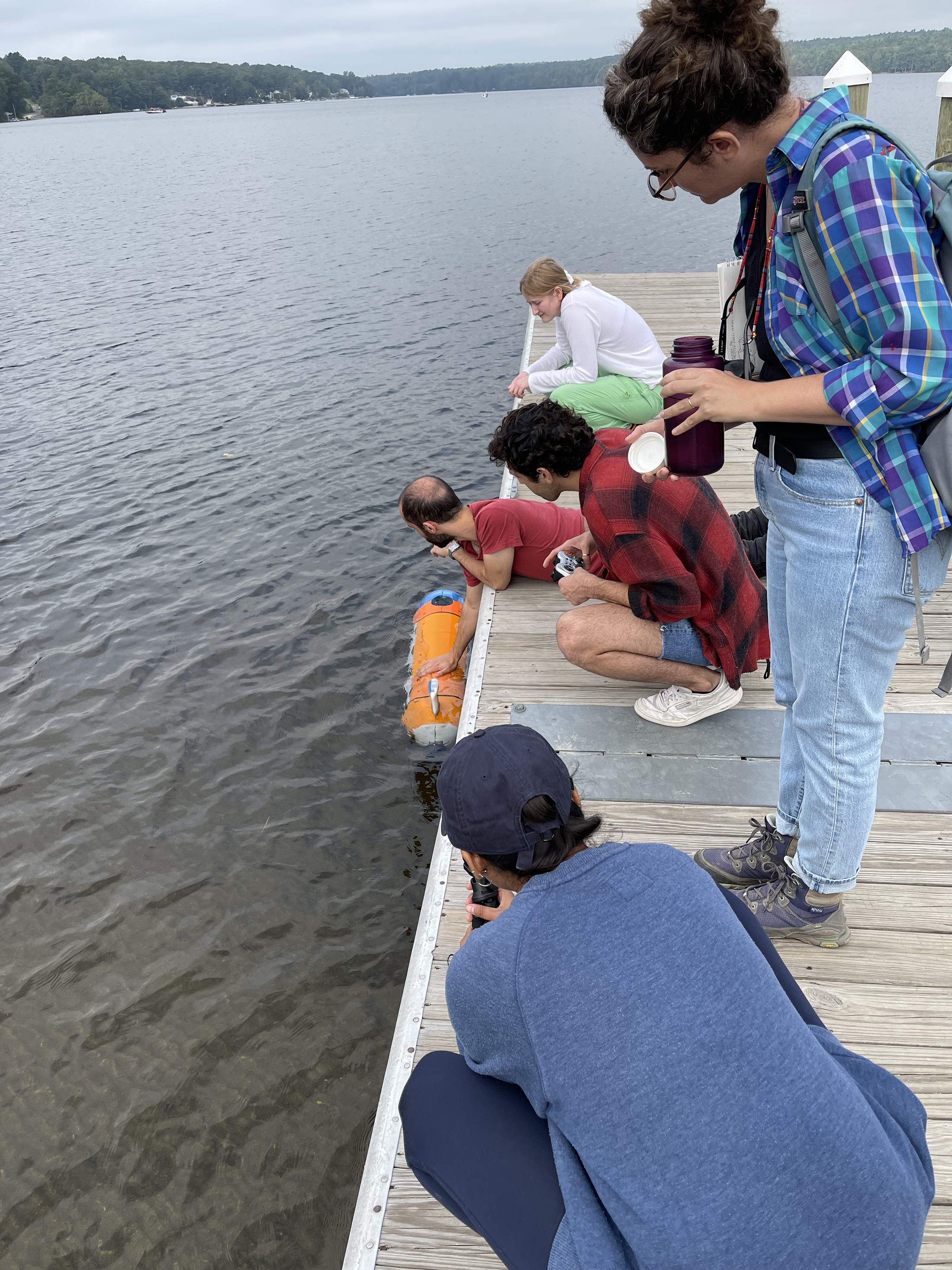 URI researchers test an ROV as RISD students look on