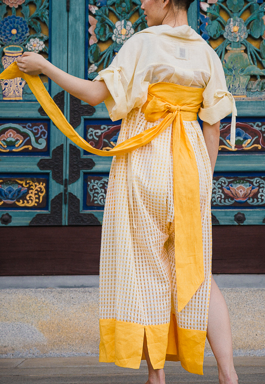 Inspired by hanbok, traditional Korean apparel, Cai’s designs feature such traditional elements as ties and wrapped fronts