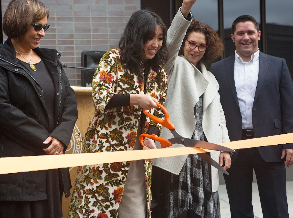 Student Alliance President Cathy Park cuts North Hall dorm ribbon