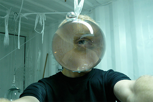Sean Salstrom MFA 06 GL conducting optical experiments in the studio