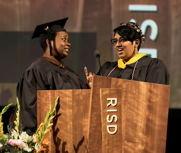Graduate student speakers Anina Major MFA 17 CR and Atulya Chaganty MID 17 delivering their parting message together