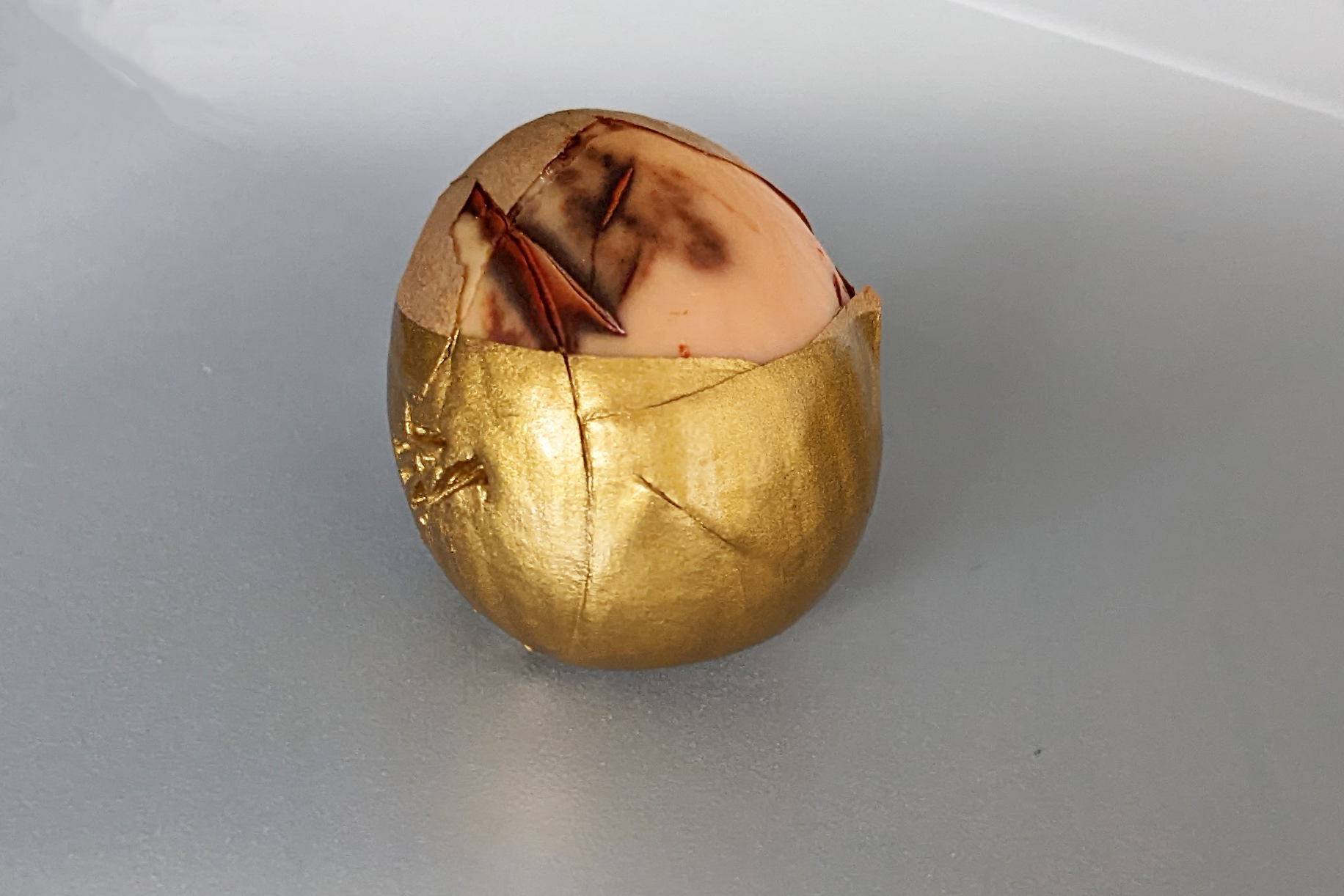 gold-dipped avocado pit