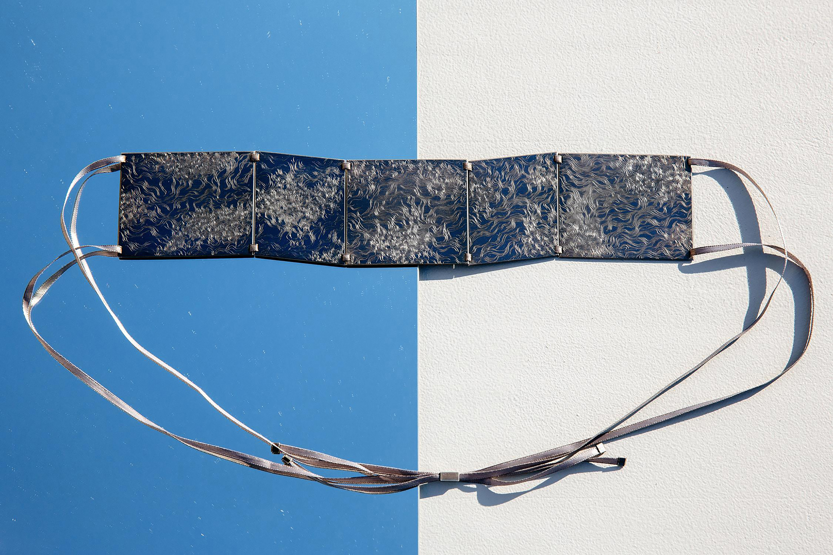 An engraved silver necklace made by Valerie James MFA 19 JM