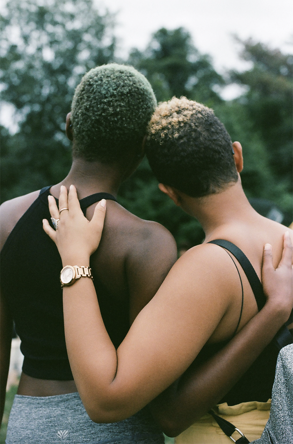 two women hugging seen from behind