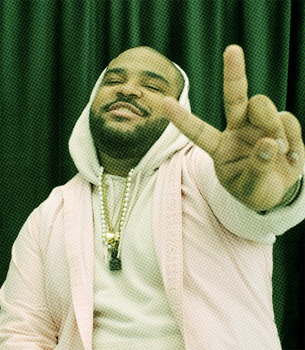pixelated image of a man making the peace sign