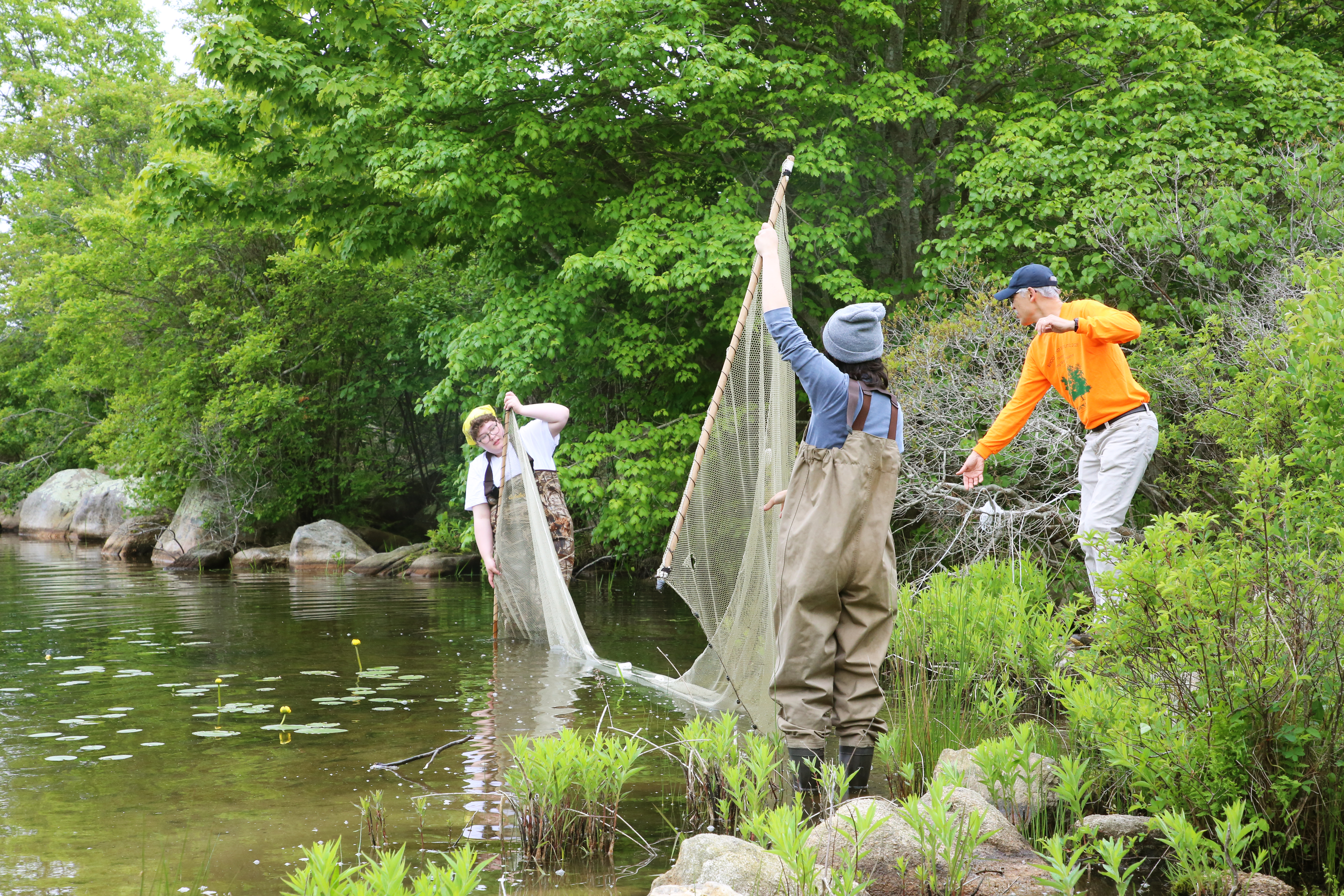 Students go fresh Pond fishing and wetland ecology with Marty Wencek from the Department of Environmental Management.