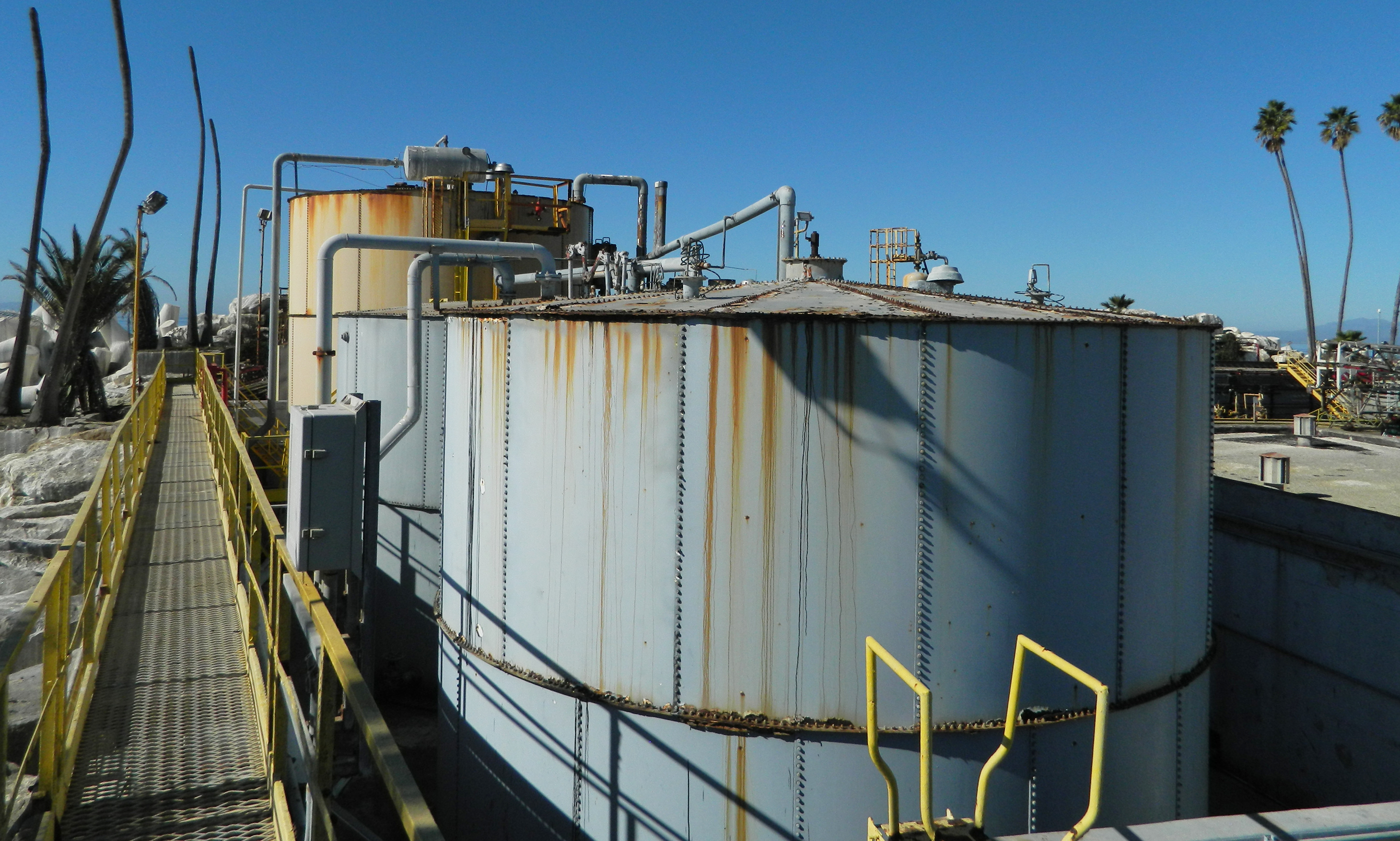 rusting oil tanks in California