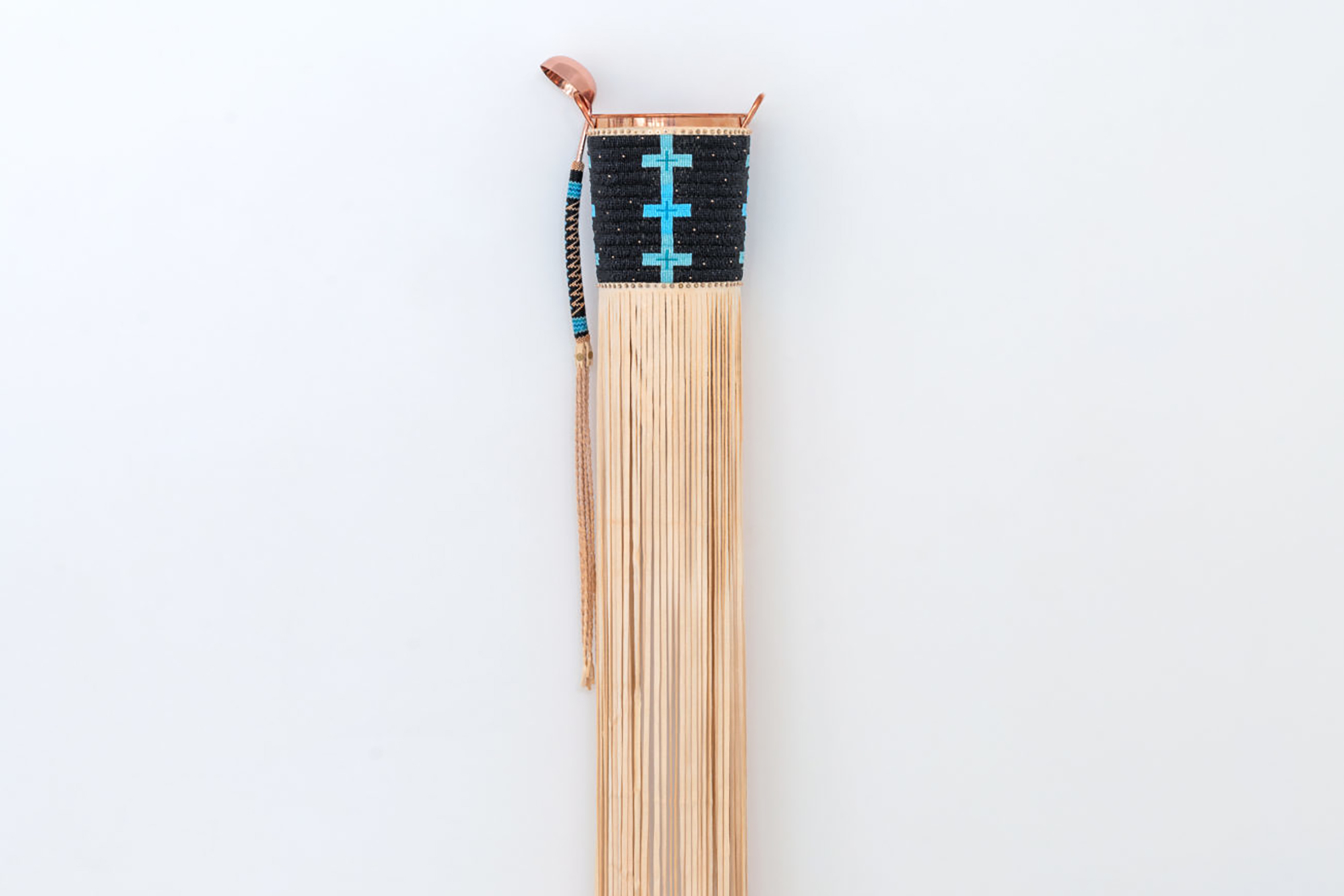 A traditional woven basket that White Hawk designed in response to the idea that art cannot be functional