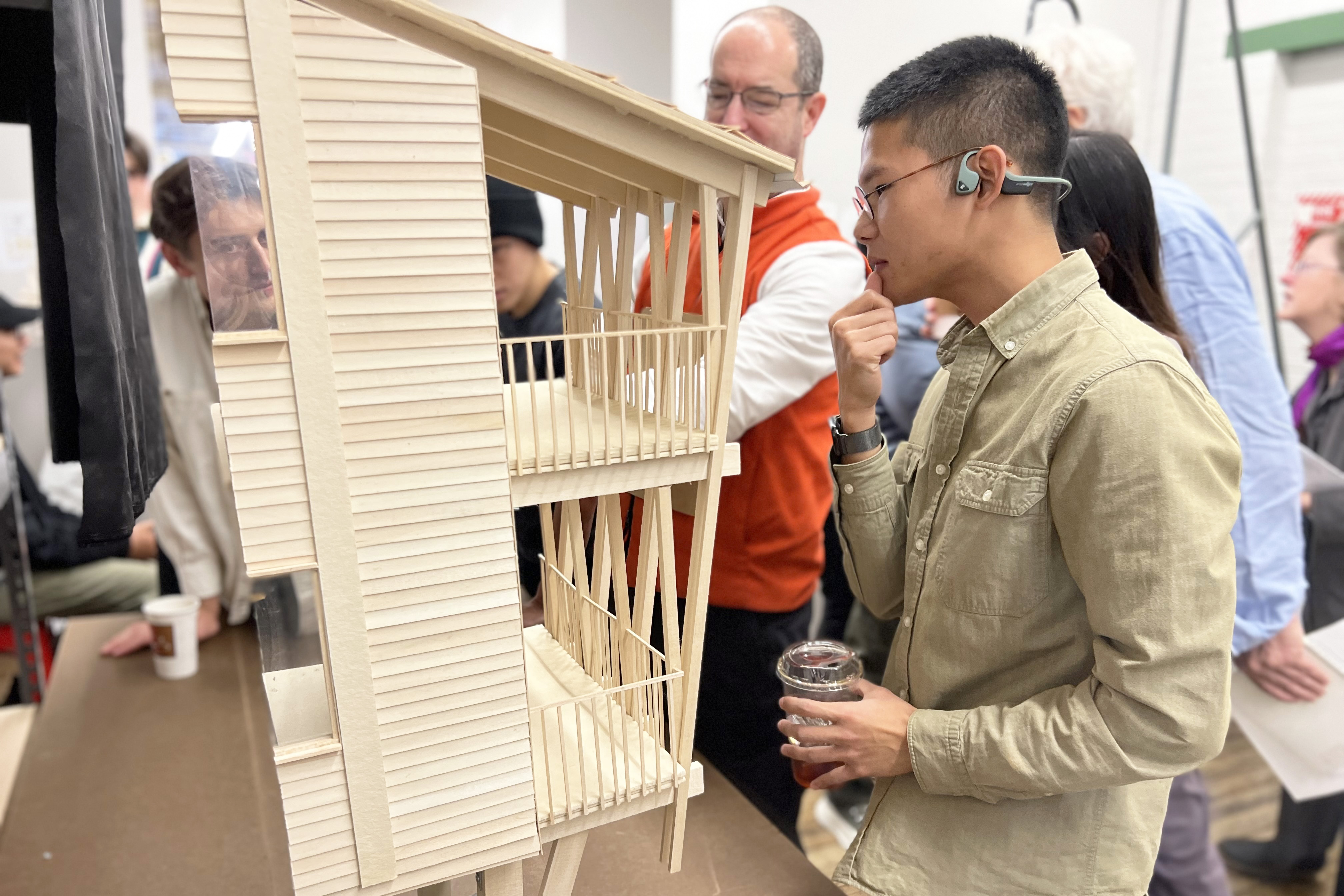 a student discusses a model with a professor